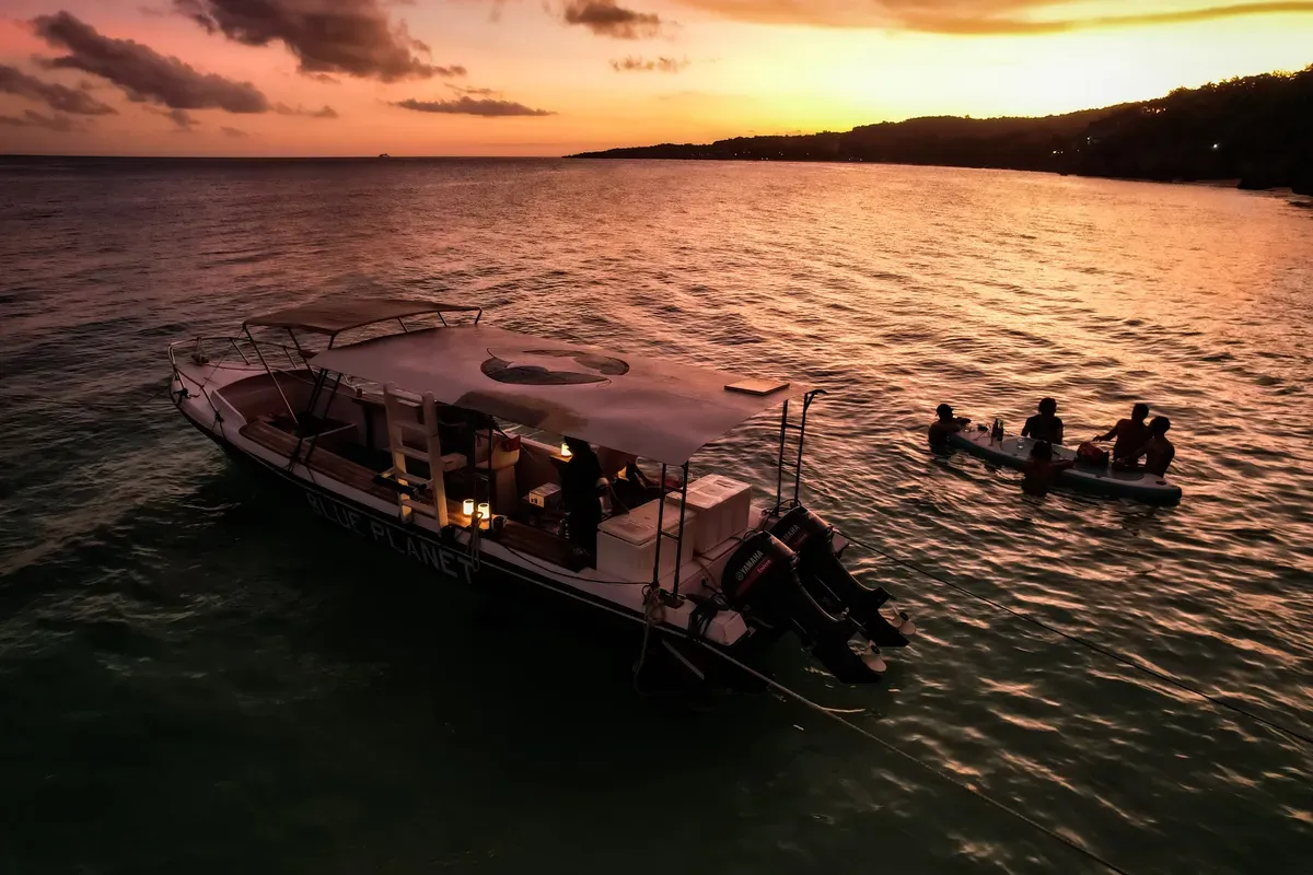 Sunset dive boat at dusk